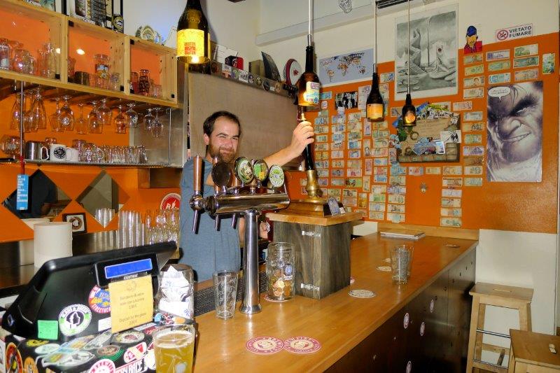 bartender filling a glass of the sour beer.